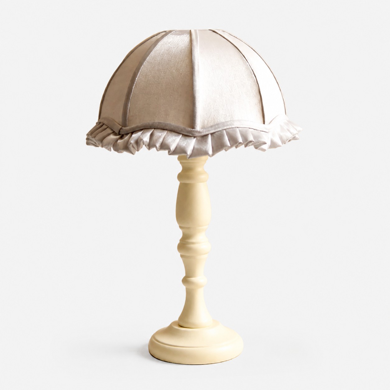 Silver fabric shade wood table lamp on white background