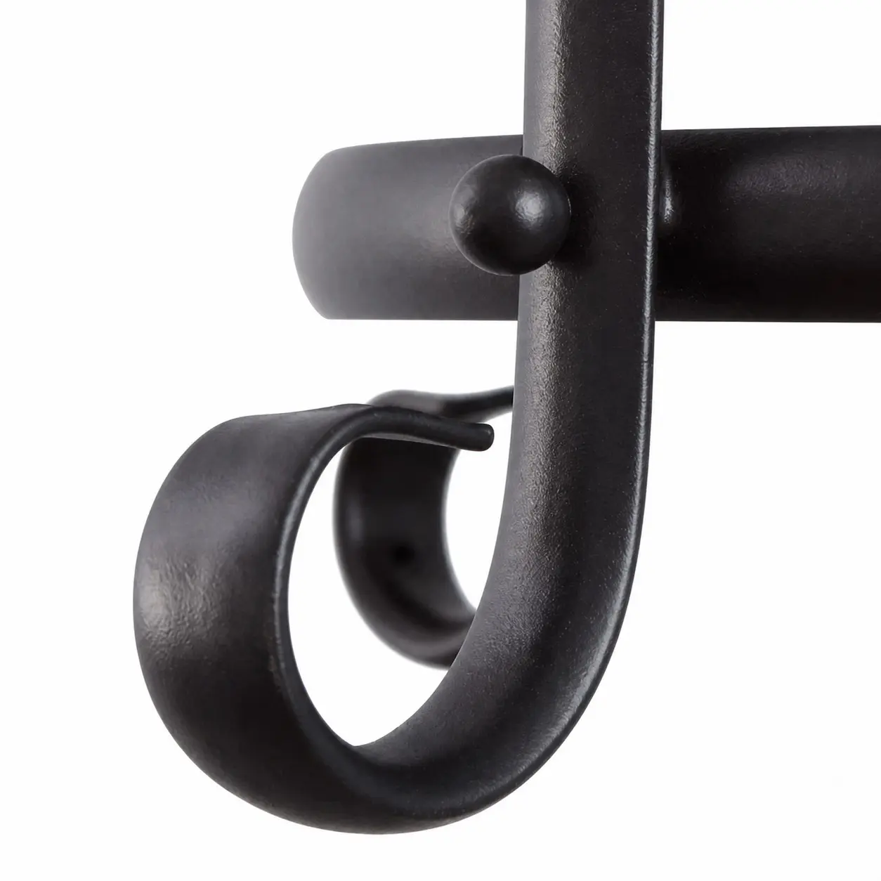 Curved black iron scrollwork detail
