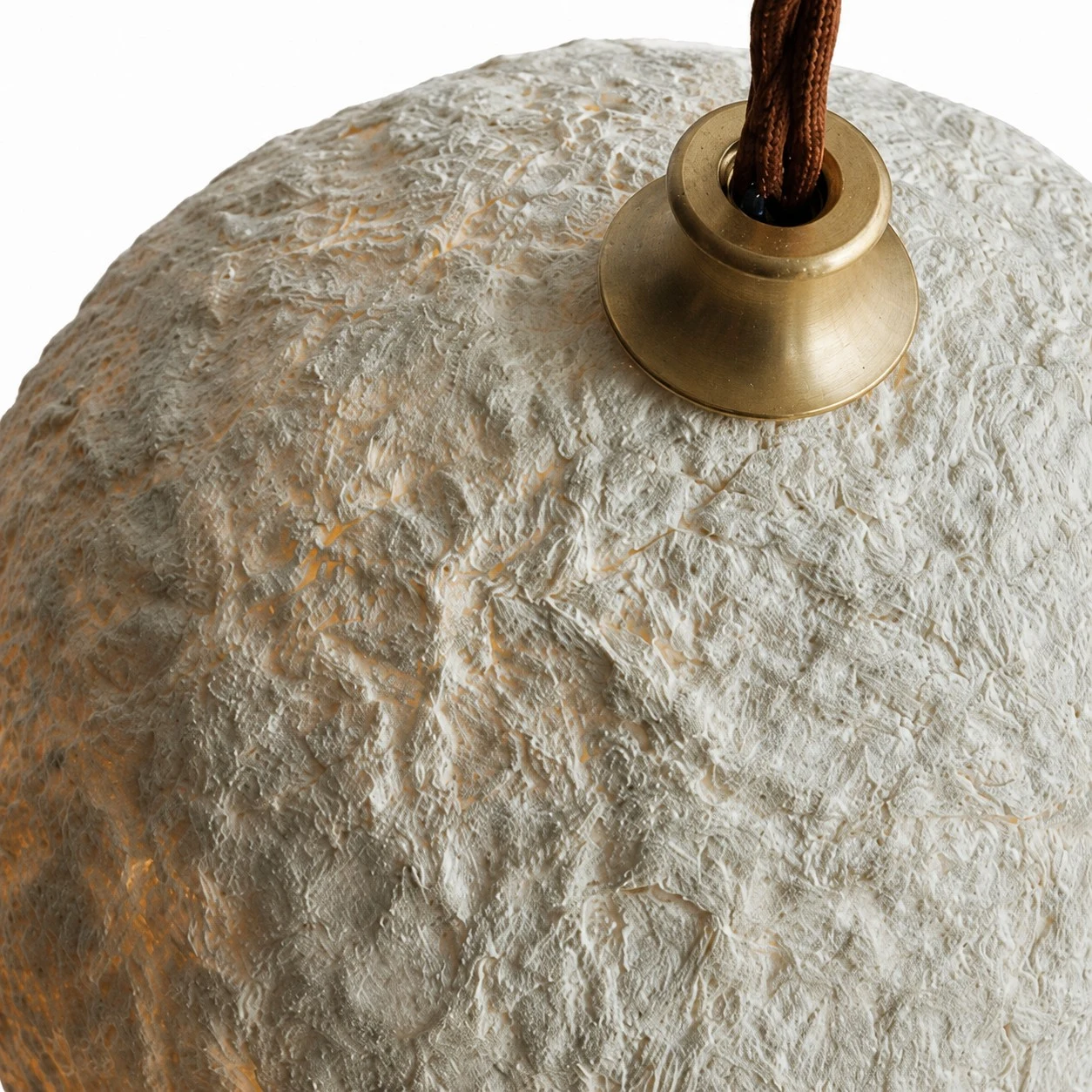 Close detail of brown holder and rice paper shade